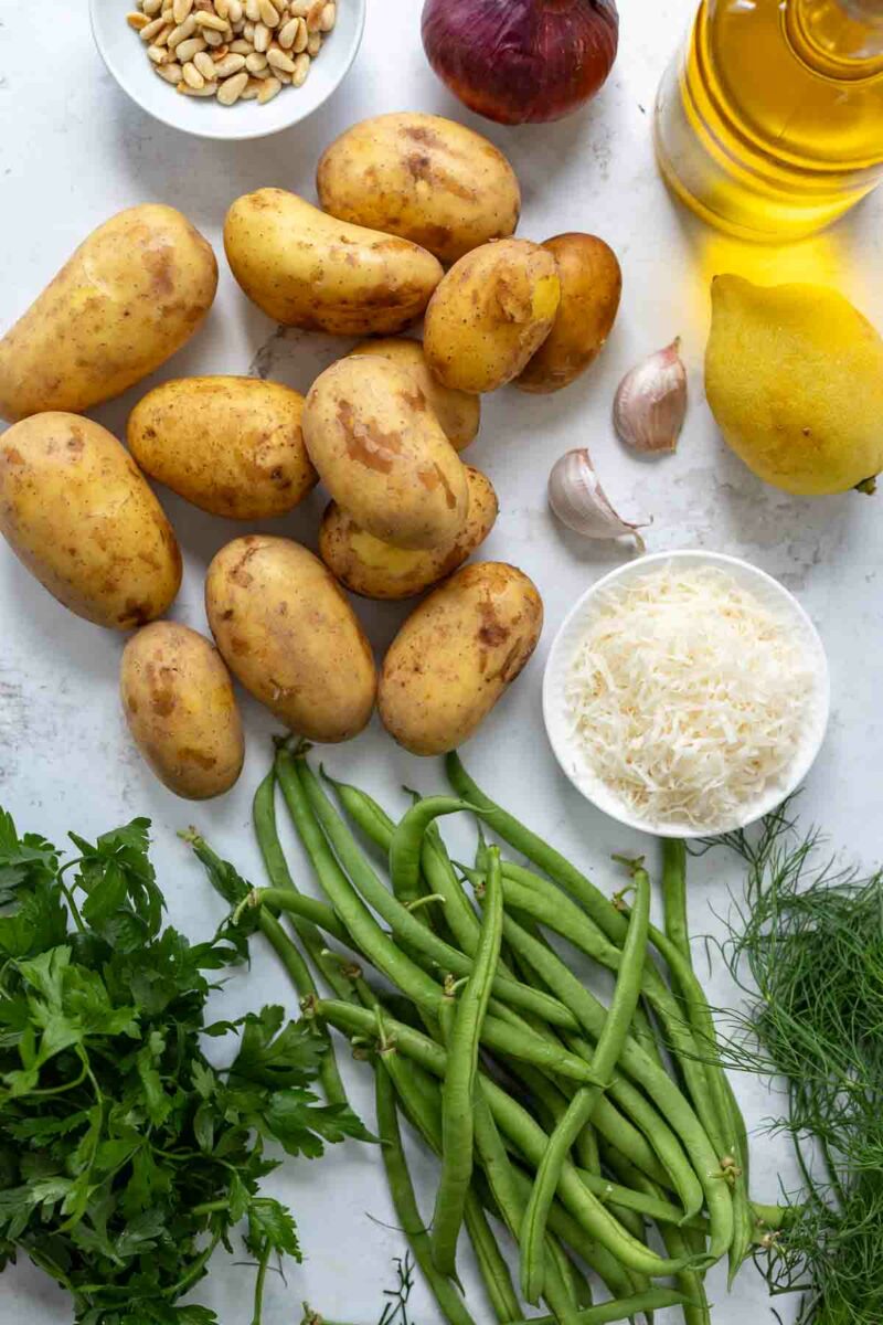 Rezept Zutaten: Kartoffeln, Bohnen, Petersielle, Dill, Parmesan, Pinienkerne, Parmesan, Olivenöl und Zitrone